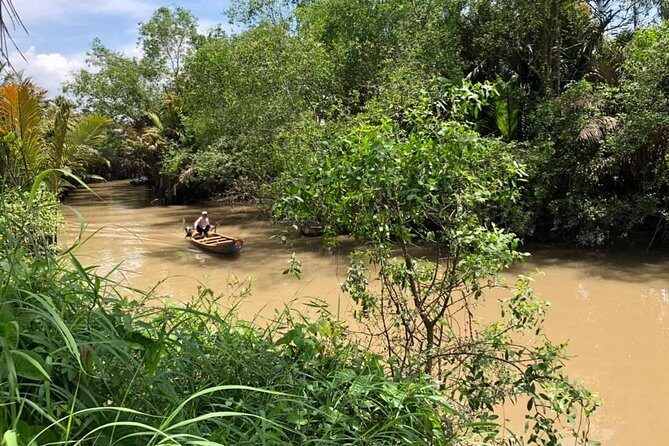 Cu Chi tunnel & Mekong Combined In One Day Tour Excursion - Coconut candy and local music: a break from history mode