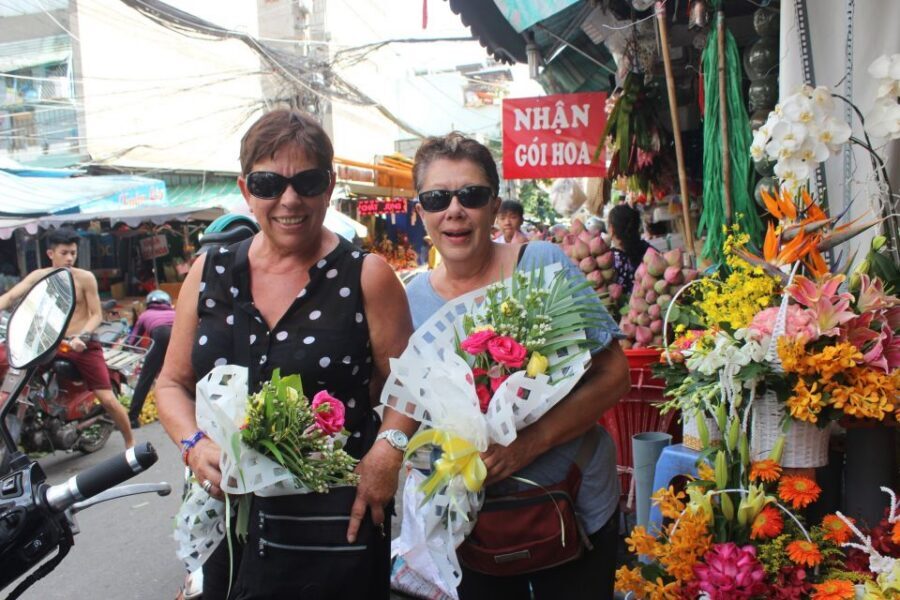 Cu Chi Tunnels and Saigon City Private Tour - Ben Thanh Market: fruit, snacks, and friendly chaos
