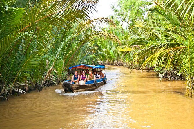 Cu Chi Tunnels & Mekong Delta Tour with VIP Limousine Transfer - Mekong Delta around My Tho: boat ride views and coconut-lined calm