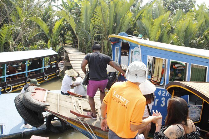 Shared Cu Chi Tunnels & Mekong Delta Tour Full Day - Mekong Delta by Motorboat and Rowing Sampan: The Best Part for Most People